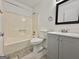 A bright bathroom featuring updated vanity, tub, and tile flooring at 10173 Brass Ring Rd, Jonesboro, GA 30238