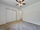 Neutral bedroom features ceiling fan and a large closet at 10173 Brass Ring Rd, Jonesboro, GA 30238