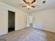 Bedroom featuring a ceiling fan and access to an ensuite bathroom at 10173 Brass Ring Rd, Jonesboro, GA 30238