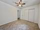 Neutral bedroom features ceiling fan and a large closet at 10173 Brass Ring Rd, Jonesboro, GA 30238