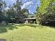 Inviting single-story home showcasing a lush front yard and mature trees at 10173 Brass Ring Rd, Jonesboro, GA 30238