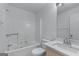 Bathroom featuring a shower-tub combo, toilet, and vanity with a sink and a mirror at 2000 Stacia Dr, Covington, GA 30016
