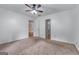A cozy bedroom with a ceiling fan and neutral carpet at 2000 Stacia Dr, Covington, GA 30016