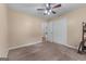 This bedroom includes plush carpet, a ceiling fan, and a closet at 2000 Stacia Dr, Covington, GA 30016
