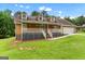 Charming home with a front porch, dormer windows, and well-maintained lawn at 2000 Stacia Dr, Covington, GA 30016