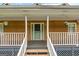 Close-up of the front porch featuring flower pots and an inviting entrance at 2000 Stacia Dr, Covington, GA 30016