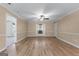 Spacious living room featuring modern flooring, fresh paint, and multiple ceiling fans at 2000 Stacia Dr, Covington, GA 30016