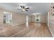 Bright and spacious living room with wood floors, ceiling fans, and an open floor plan at 2000 Stacia Dr, Covington, GA 30016