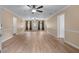 Spacious living room featuring modern flooring, fresh paint, and multiple ceiling fans at 2000 Stacia Dr, Covington, GA 30016