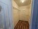 Spacious walk-in closet with wood floors and wire shelving for organization and storage at 10 Nicole Ct, Covington, GA 30016