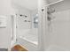 Bathroom features a large soaking tub, separate shower stall, and bright window at 615 Coan Dr, Locust Grove, GA 30248