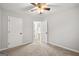 Neutral bedroom with carpet and two closets provides ample storage space at 615 Coan Dr, Locust Grove, GA 30248