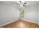 Light and bright bedroom with wood floors and a ceiling fan at 615 Coan Dr, Locust Grove, GA 30248