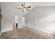Spacious bedroom with high ceilings, ceiling fan, and neutral paint at 615 Coan Dr, Locust Grove, GA 30248
