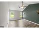 Spacious bedroom with high ceilings, ceiling fan, two windows, and neutral paint at 615 Coan Dr, Locust Grove, GA 30248