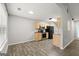 Open concept kitchen features laminate floors, shaker cabinets and stainless steel appliances at 615 Coan Dr, Locust Grove, GA 30248