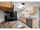 This kitchen features granite countertops, stainless steel appliances, and white subway tile backsplash at 615 Coan Dr, Locust Grove, GA 30248
