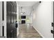 Inviting open-concept living area with a fireplace, ceiling fan and hardwood floors at 615 Coan Dr, Locust Grove, GA 30248