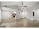 Open-concept living area seamlessly connects to the kitchen with updated flooring and neutral walls at 615 Coan Dr, Locust Grove, GA 30248