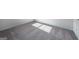 Bedroom shows light gray carpet and baseboard, with sunlight shining into the room at 471 Prescott Way, Villa Rica, GA 30180