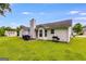 Spacious backyard featuring a well-maintained lawn, with an area for outdoor dining and grilling at 102 Natalie Ct, Dallas, GA 30157