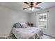 Bedroom with a queen-size bed, modern lighting, and a large window at 102 Natalie Ct, Dallas, GA 30157