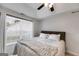 Comfortable bedroom with a large window and a cozy knit blanket on the bed at 102 Natalie Ct, Dallas, GA 30157