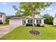 Attractive single-story home with a well-kept lawn, white siding, and a lovely shade tree in the front yard at 102 Natalie Ct, Dallas, GA 30157