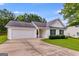 Inviting single-story home with a two-car garage, neat landscaping, and classic white siding at 102 Natalie Ct, Dallas, GA 30157