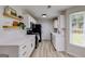 Bright kitchen featuring white cabinets, modern appliances, and open shelving at 102 Natalie Ct, Dallas, GA 30157