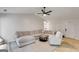Spacious living room boasts stylish furniture, wood floors, and a vaulted ceiling at 102 Natalie Ct, Dallas, GA 30157