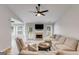 Open living room with vaulted ceilings, a ceiling fan, and a cozy fireplace at 102 Natalie Ct, Dallas, GA 30157