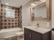 Modern bathroom featuring a vanity, toilet, and bathtub/shower combo at 2739 Flagstone Se Dr, Atlanta, GA 30316