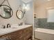 Charming bathroom features a double vanity and a separate tub at 2739 Flagstone Se Dr, Atlanta, GA 30316