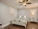 Cozy bedroom with a ceiling fan, hardwood floors, and neutral decor at 2739 Flagstone Se Dr, Atlanta, GA 30316