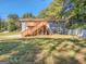 Charming multi-level home with wooden decks, surrounded by lush greenery and a spacious yard at 2739 Flagstone Se Dr, Atlanta, GA 30316