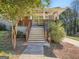Inviting front porch with classic railing, fan and stairs to the front door at 2739 Flagstone Se Dr, Atlanta, GA 30316
