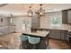 Well-lit kitchen with a granite island, bar stools, and modern pendant lighting at 2739 Flagstone Se Dr, Atlanta, GA 30316