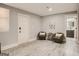 Spacious living room featuring hard flooring, two chairs, and door to bathroom at 2739 Flagstone Se Dr, Atlanta, GA 30316