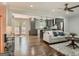 Open-concept living room with hardwood floors, ceiling fan, and seamless transition to the kitchen at 2739 Flagstone Se Dr, Atlanta, GA 30316