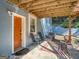 Cozy covered patio with seating and a vibrant rug, creating an inviting outdoor living space at 2739 Flagstone Se Dr, Atlanta, GA 30316