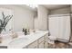 Bathroom featuring a double vanity with quartz countertops and modern fixtures at 5662 Valley Loop, Fairburn, GA 30213