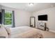 Bedroom features soft lighting, neutral color, queen bed, and full size mirror at 5662 Valley Loop, Fairburn, GA 30213