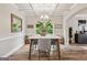 Cozy dining area with decorative wall hangings, complemented by a marble table and stylish seating, creating a warm ambiance at 5662 Valley Loop, Fairburn, GA 30213