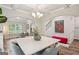 Bright dining room featuring a modern chandelier and large marble table for an elegant and inviting dining experience at 5662 Valley Loop, Fairburn, GA 30213