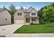 Charming two-story home with brick and siding, a well-manicured lawn, and an attached two-car garage at 5662 Valley Loop, Fairburn, GA 30213