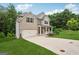 Beautiful two-story home boasts a well-kept lawn and attached garage, blending brick and siding details at 5662 Valley Loop, Fairburn, GA 30213