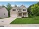 Charming two-story home with brick and siding, a well-manicured lawn, and an attached two-car garage at 5662 Valley Loop, Fairburn, GA 30213