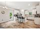 Well-lit kitchen featuring an island with bar seating, stainless steel appliances, and ample countertop space for cooking at 5662 Valley Loop, Fairburn, GA 30213