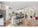 Spacious kitchen with white cabinets, an island with seating, and stainless steel appliances, perfect for entertaining at 5662 Valley Loop, Fairburn, GA 30213